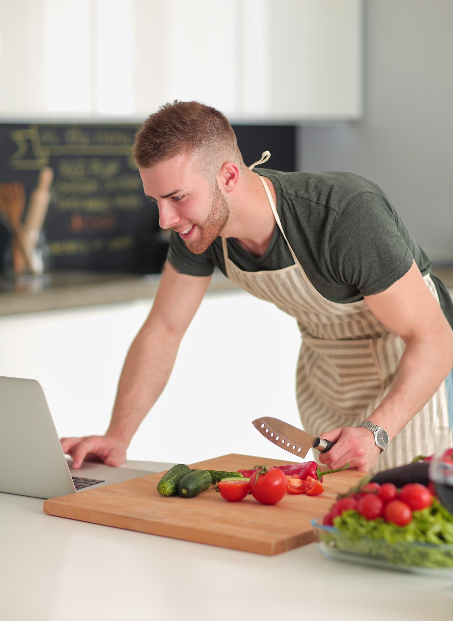 Instructor preparing fresh ingredients on a wooden board